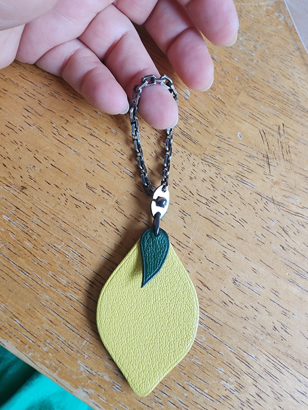 Hermès leather lemon bag charm featuring a green leaf. - Picture 9 of 10
